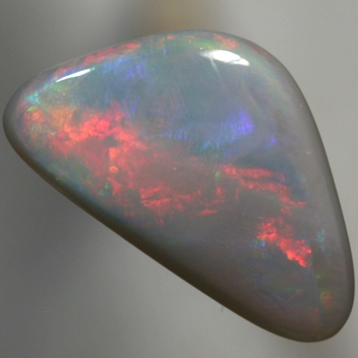 SOLID SEMI BLACK OPAL Large rolling flashes of red with violet